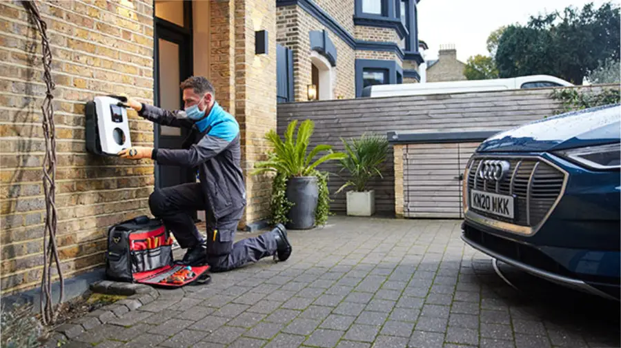 workers installing ev charging posts