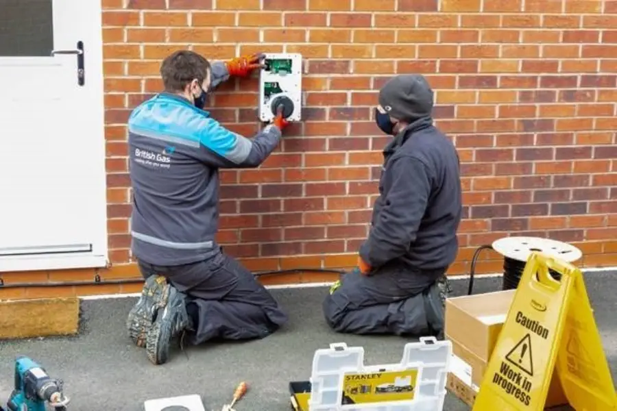 workers installing electric car charging posts